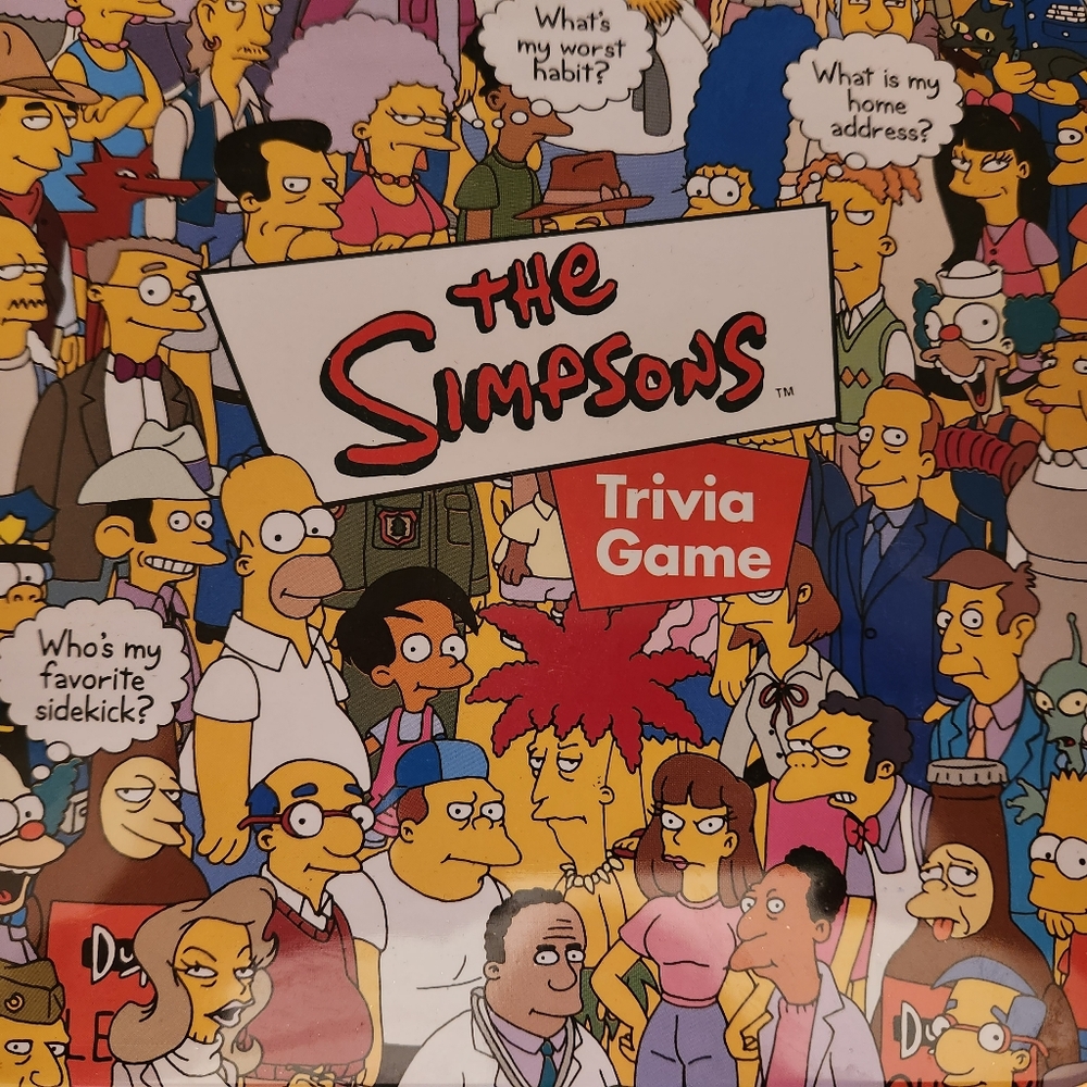 The Simpson's Trivia Game, opened, but not used. cool tin!